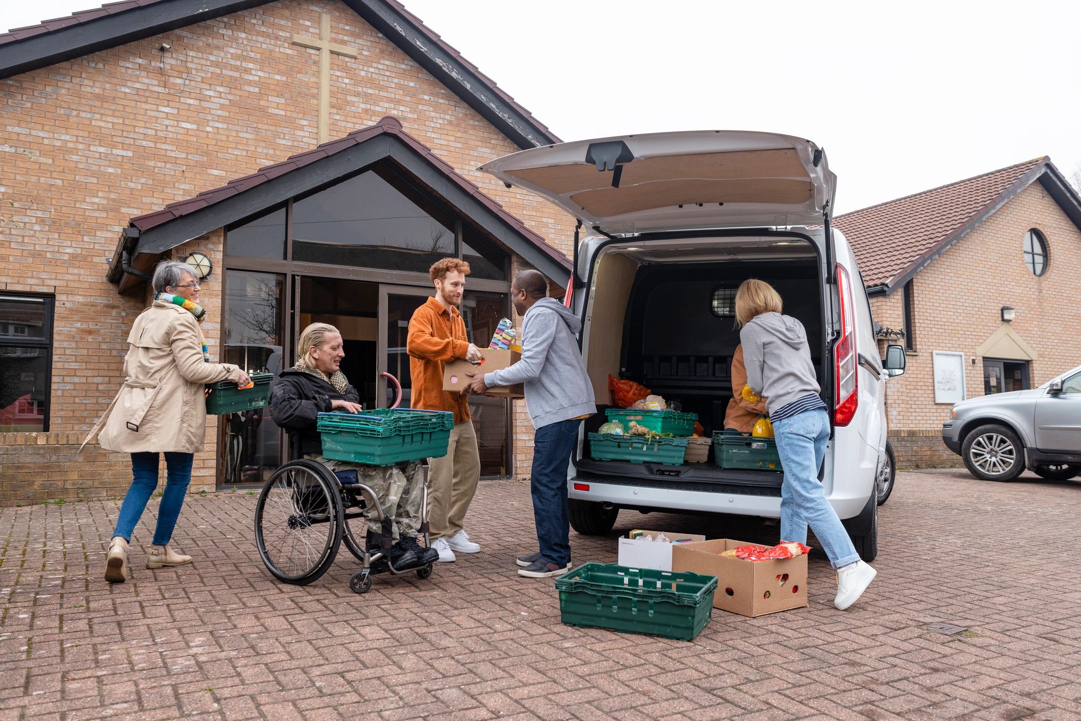 Volunteers unloading donated supplies for community support