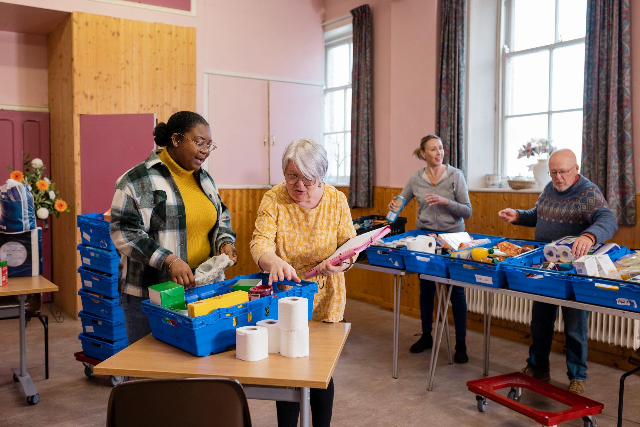 Volunteers organizing supplies for community support