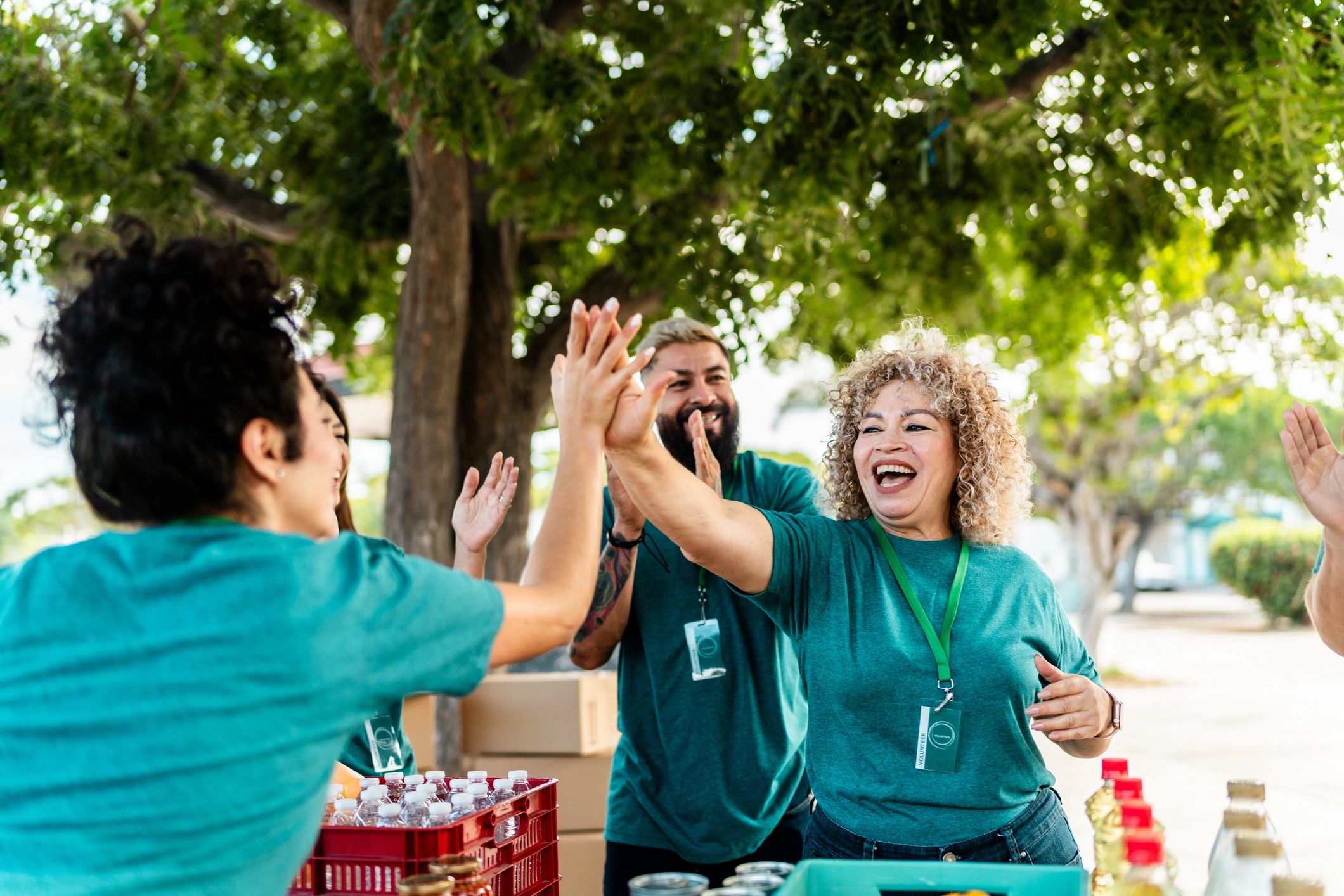Volunteer organizing donation boxes outdoors